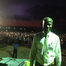 Pastor Voltaire Enjoys the Harvest...Pastor Emilio Voltaire head of the Pastors' League enjoys the harvest